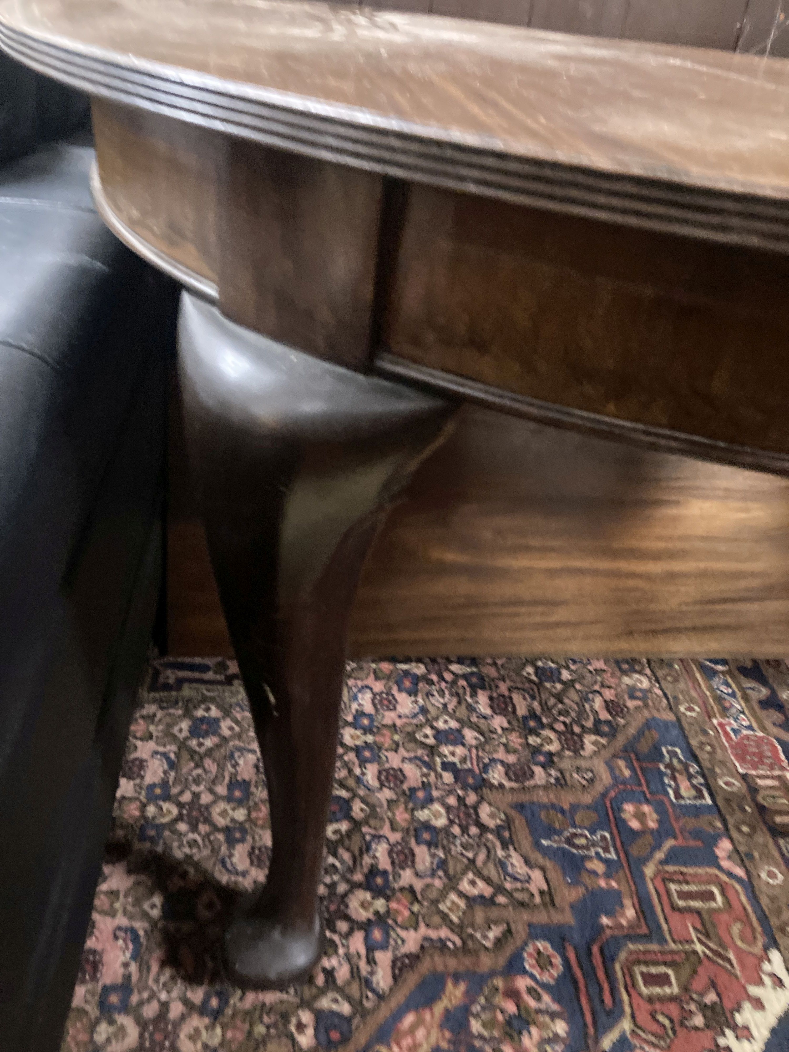 A 1920's circular mahogany extending dining table with three leaves and handle, length approx. 230cm extended, width 120cm, height 75cm